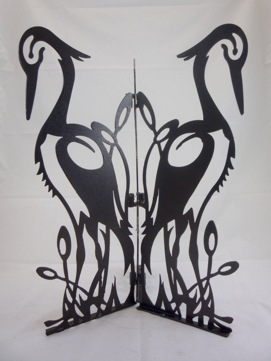 Laser-cut steel birdbath base with crane silhouette in hammered bronze finish.