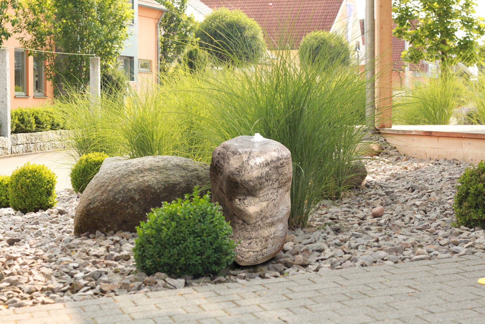 Bamboo Stone with leaf design in garden, ideal for landscaping projects.