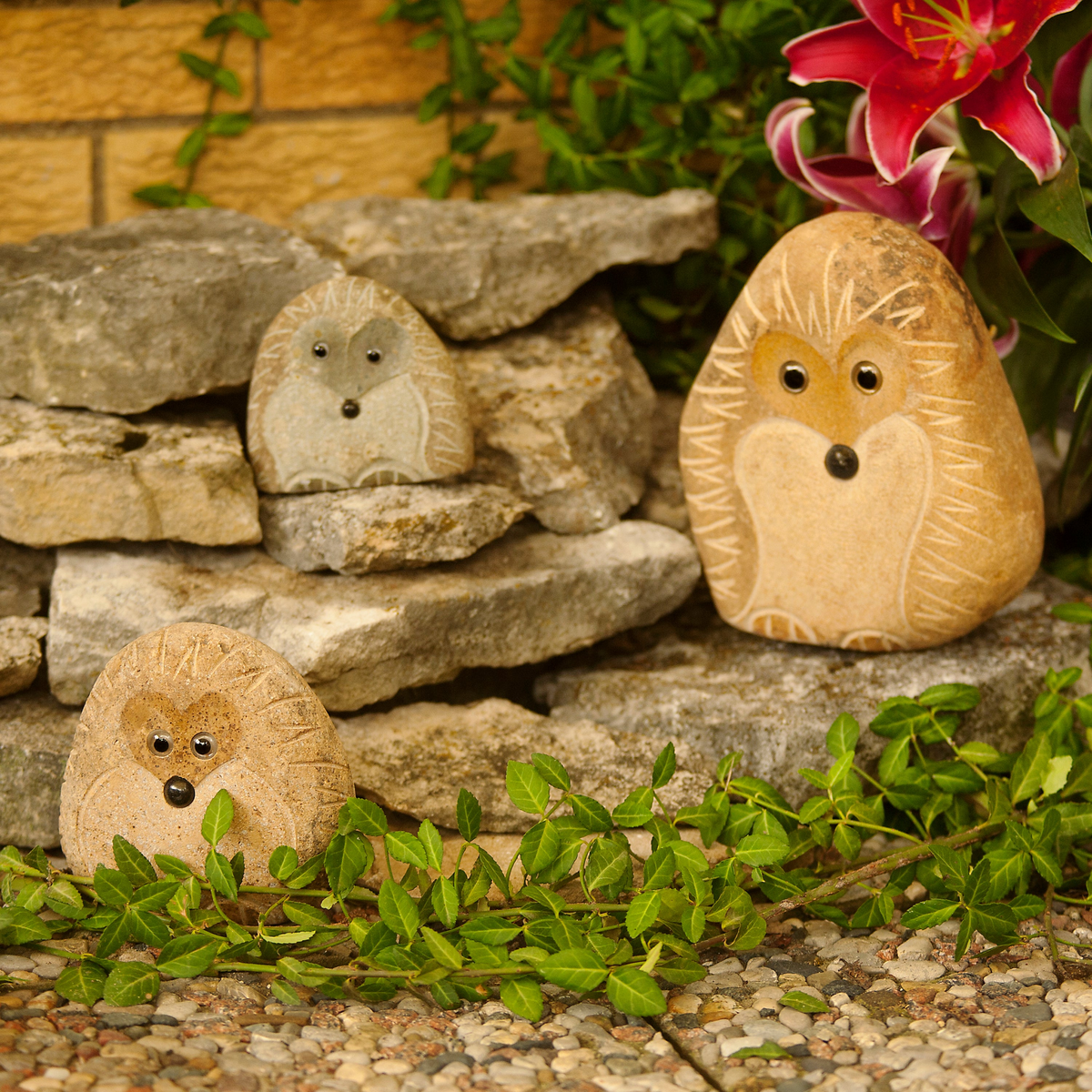 Hand-carved granite boulder hedgehog family set; includes three sizes: 4", 6", and 8", perfect for garden decor.