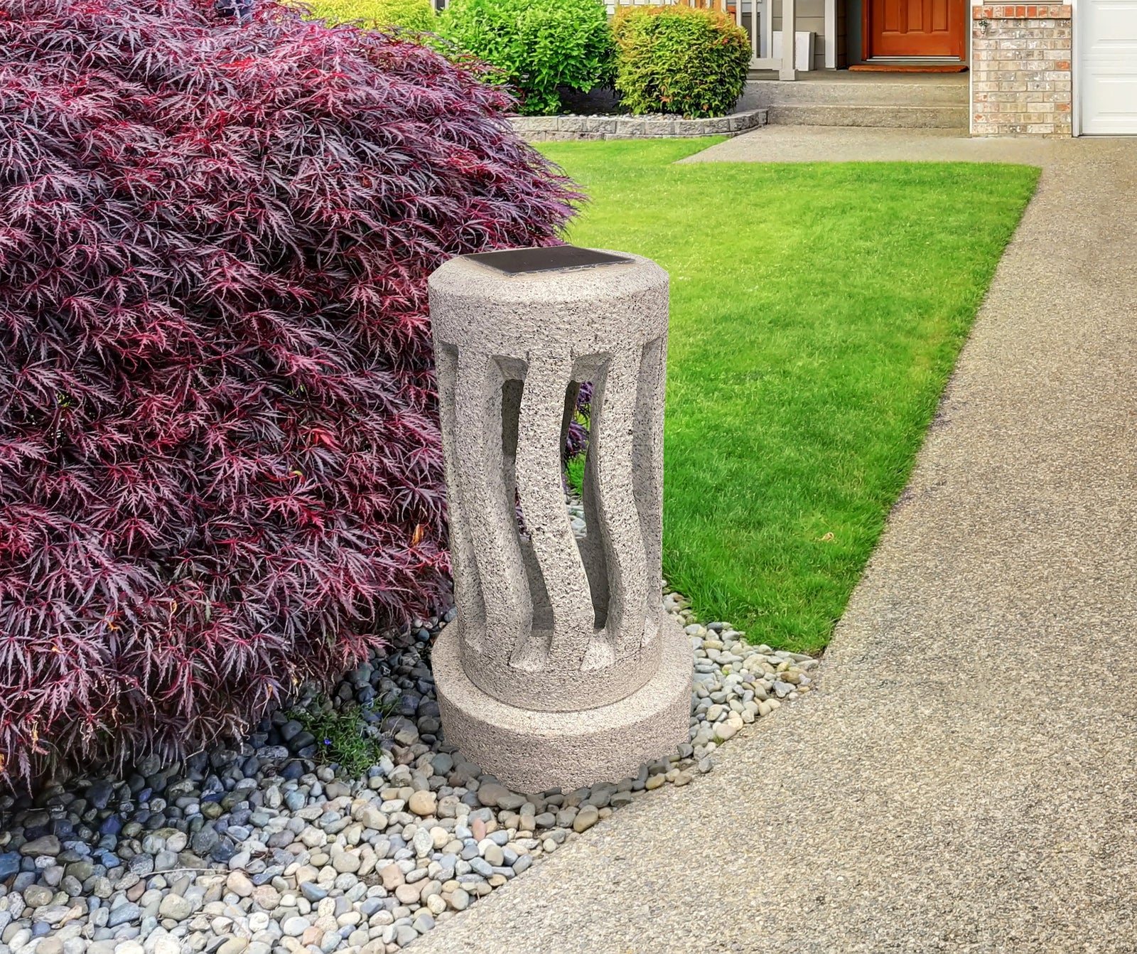 Spiral Granite Solar Lantern in a garden setting.